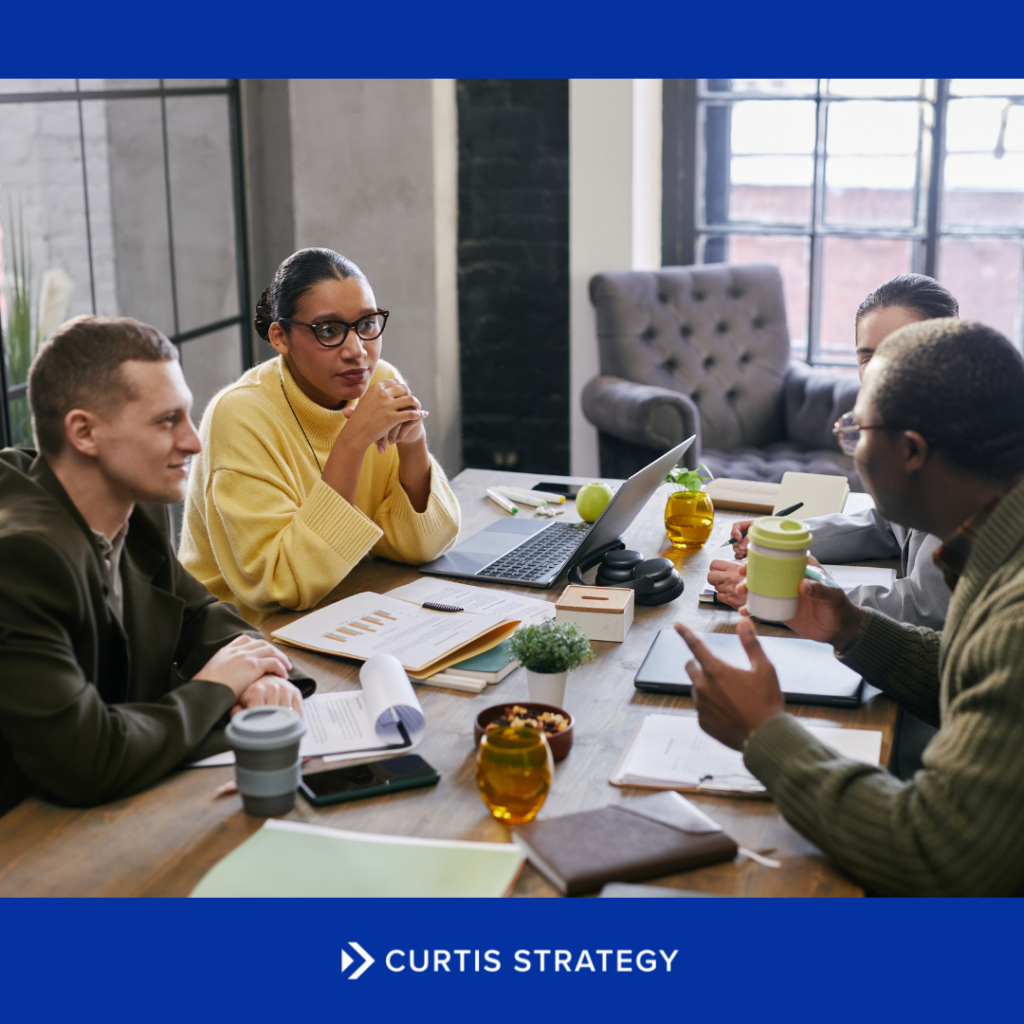 Executive leadership team and board members collaborating during a credit union strategic planning session focused on long-term governance.