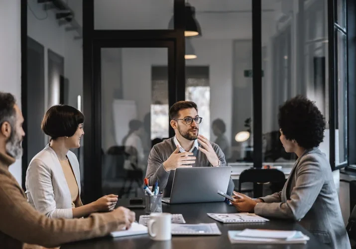 People have meeting at desk